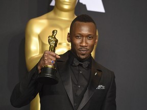 Mahershala Ali poses in the press room with the award for best actor in a supporting role for "Moonlight" at the Oscars on Sunday, Feb. 26, 2017, at the Dolby Theatre in Los Angeles.