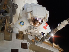 The Canadian Space Agency (CSA) Astronaut Dave Williams performs a spacewalk during Shuttle Mission STS-118.