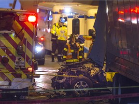 Emergency crews work at the scene of a fatal collision involving three tractor trailers and a car Highway 401 near Cabana Road on Tuesday Feb. 7, 2017.