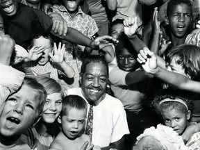 Windsor police detective Alton C. Parker poses with a group of happy youngsters in this July 24,1969 photo.