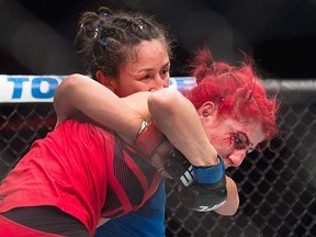 Windsor MMA fighter Randa Markos (in red) battles with opponent Carla Esparza at UFC Fight Night 105 in Halifax on Feb. 19, 2017.