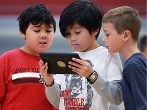 Over 500 students from Corpus Christ Catholic Middle School and its feeder schools participated in a technology summit at the F.J. Brennan High School on Friday, February 17, 2017. Matteo Grossi, left, Louis Cortez and Shawn Branton from St. Rose School figure out how to control a robot during the event.