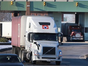 A truck enters Windsor after clearing Canadian customs at the Ambassador Bridge on Friday, Feb. 3, 2017.