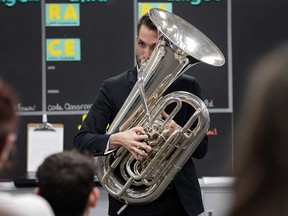 Windsor-born professional tuba player Jarrett McCourt demonstrates his art for a music class at L'Essor Catholic high school in Tecumseh on Feb. 2, 2017.