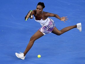 In this Jan. 28, 2017, photo, United States' Venus Williams makes a forehand return.
