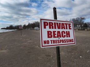 A sign marks the end of the public beach along the shore of Lake Erie in Essex County on Thursday, Feb. 16, 2017.