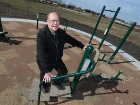 Coun. Hilary Payne gets a look at some new outdoor fitness equipment installed at Walker Homesites Park in Windsor on Friday, Feb. 17, 2017.