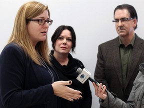 Local NDP members Tracey Ramsey, Lisa Gretzky and Brian Masse (left to right) discuss issues at the United Way offices in Windsor on Friday, Feb. 17, 2017.