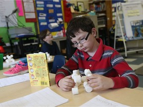 Caiden Gage works with shapes during a Grade 2 math class at St. Bernard Catholic School in Windsor on Feb. 21, 2017. EQAO testing in the Windsor-Essex Catholic system shows almost 62 per cent of its elementary schools reduced the percentage of EQAO tests not meeting provincial standards over the past five years.