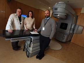 Dr. Ken Schneider, left,  Monica Staley Liang and Jeff Richer are photographed in the radiation treatment area of the Windsor Regional Cancer Centre on Feb. 22, 2017.