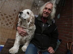 John Bradac is photographed with his dog Buddy at his home in Windsor on Friday, February 24, 2017.