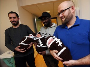Newborn babies Ahmad Choubassi, left, Allen Ojo and Ava Katherine Moore are bundled up in their knit football outfits as they are held by proud fathers Mohammed Choubassi, left, Wale Ojo and Christian Chartrand on Super Bowl Sunday at Windsor Regional Hospital in Windsor in Windsor on Feb. 5, 2017.