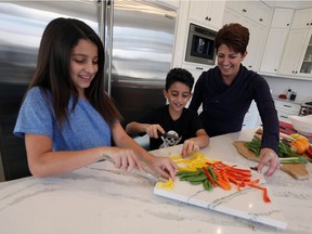 Michelle Prince, pictured with her children Sienna, left, and Phoenix at their Windsor home Feb. 9, 2017, is prepared to answer questions about her cancer journey.