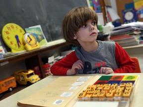 Tristan Burk works with his education assistant Darlene Momney, not shown, at Our Lady of Annunciation in Stoney Point on Feb. 8, 2017. Burk has a rare but devastating genetic disorder called SCN8A.