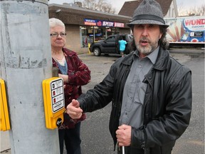 Community advocate for persons with disabilities Peter Best, right, along with Shauna Boghean stand at the intersection of Strabane and Wyandotte Streets on  February 24, 2017. The intersection has a new audio pedestrian signal (APS) system to assist visually impaired and hard of hearing cross the street.