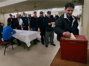 K+S Windsor Salt employee Tony Arpino casts his ballot during a contract ratification vote on Monday, Feb. 20, 2017 at the Verdi Club in Amherstburg.