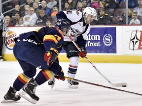 Windsor Spitfires Aaron Luchuk looks to shoot in front of Erie Otters Erik Cernak during an OHL game on Feb. 12, 2017 at Erie Insurance Arena.