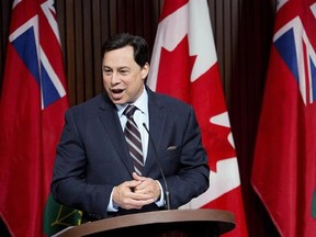 Brad Duguid, responds to questions at Queen&#039;s Park in Toronto on Friday, March 28, 2014. Economic Development Minister Brad Duguid and International Trade Minister Michael Chan are heading to New York state to urge legislators to exempt Canada from a Buy American policy it plans to introduce, warning that it could lead to trouble on both sides of the border. THE CANADIAN PRESS/Nathan Denette