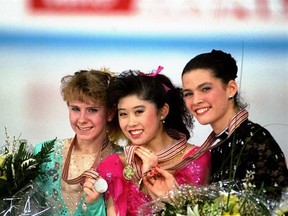 FILE - In this March 12, 1991, file photo, American skaters (L to R) Tonya Harding, silver; Kristi Yamaguchi, gold; and Nancy Kerrigan, bronze, display their medals after the finals of the World Figure Skating Championships in Munich. A run-of-the-mill good luck tweet from Yamaguchi to Kerrigan is drawing online attention. Yamaguchi tweeted a message to Kerrigan ahead of Kerrigan‚Äôs performance on Monday‚Äôs ‚ÄúDancing with the Stars‚Äù March 20, 2017, and added ‚Äúbreak a leg.‚Äù Kerrigan was