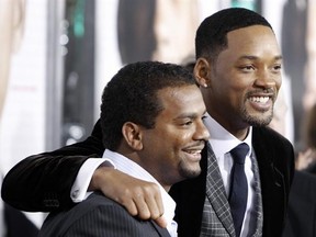 FILE - In this Dec. 16, 2008, file photo, Will Smith, right, and Alfonso Ribeiro pose together at the premiere of &ampquot;Seven Pounds&ampquot; in Los Angeles. Ribeiro posted a picture of himself with Smith and their &ampquot;Fresh Prince of Bel Air&ampquot; cast mates on Instagram March 27, 2017. (AP Photo/Matt Sayles, File)