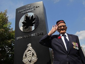 Pte. Leslie Tetler, 95, the last known member of The Essex Scottish Regiment who fought on Red Beach during Operation Jubilee in Dieppe, France, salutes during a ceremony at Windsor's Dieppe Park August 19, 2015.