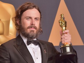 Casey Affleck holds up his best actor Oscar for his role in Manchester By The Sea during the Academy Awards on Feb. 26, 2017, in Los Angeles.