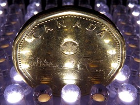 A loonie is pictured in North Vancouver, in April 2014.