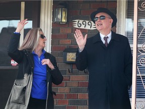 Jeannie Chaborek, left, speaks with Superior Court Justice Thomas Carey on March 21, 2017 at Chaborek's father's home on Indian Road in Windsor, Ont.