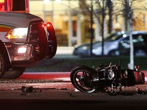 A damaged motorcycle rests on Cabana Road after a collision with a minivan on March 9, 2017