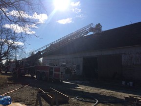 Crews with Essex Fire & Rescue extinguish a blaze at a barn in the 2800 block of County Road 20 on Saturday, March 11, 2017.