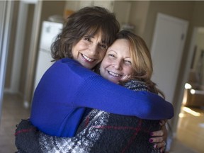 Jackie Apostol-Pizzuti, left, author of Healing Pretty, meets for the first time with Kelly Trudell, a cancer patient, at Apostol-Pizzuti's home, Sunday, March 5, 2017.