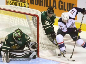 Cliff Pu of the London Knights chases Gabriel Vilardi of the Windsor Spitfires around the net to try and prevent a wrap-around on London goaltender Tyler Parsons during the second period of Game 2 on March 26, 2017 at Budweiser Gardens.