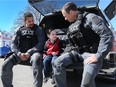 Officers with the Windsor Police Service held a Coffee with a Cop event at the Gino and Liz Marcus Centre on Wednesday, March 29, 2017 to meet members of the community and discuss issues. Const. Dan Ilievski, left, and Const. Dean Sirola chat with Asher Markos, 3, during the event.