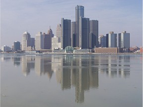 The Detroit skyline is reflected off the Detroit River on Feb. 6, 2017.