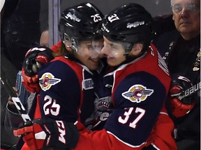 Windsor Spitfires' Graham Knott, right, celebrates with Julius Nattinen after Knott scored against the London Knights in Game 4 at the WFCU Centre in Windsor, Ont., on March 30, 2017.