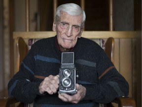 Robert Dumouchelle, 98, holds his 1930s Rolleicord camera that he used during the Second World War as part of a photo reconnaissance squadron. Dumouchelle compiled his memoirs and photographs from the war in his 1997 book, Memoirs of an Erk.