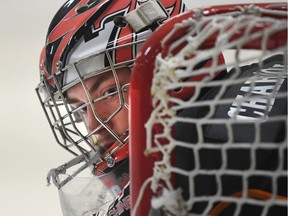 Essex 73's goaltender Tyler Ryan watches the puck during second-period action of Great Lakes Junior C playoff game against the Lakeshore Canadiens in Essex on March 10, 2017.