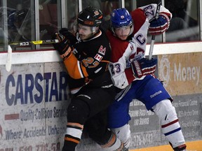 Essex 73's Luke Gecse collides with Lakeshore Canadiens Michael Long during last year's Bill Stobbs Division final.