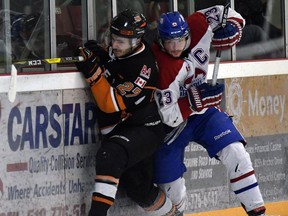 Lakeshore Canadiens captain Michael Long, seen at left battling Essex's Luke Gecse, is now focused on a run at a Schmalz Cup title.