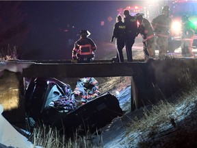 Essex firefighters,  Ontario Provincial Police officers and Windsor-Essex EMS paramedics work the scene of a serious two-vehicle accident on North Malden Road near Trembley Road in Essex on March 17, 2017.