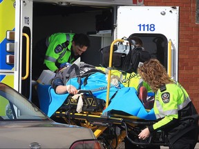 Paramedics load a woman into an ambulance at the Cencourse apartment building at 30 Tuscarora St. in Windsor, ON. on Thursday, March 9, 2017. The woman fell from a balcony landing on the second floor roof. The incident occurred at approximately 10:30 a.m. The extent of the injuries are unknown.