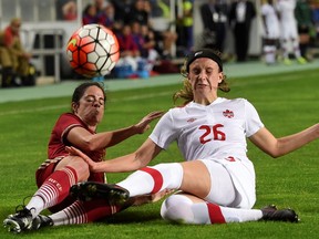 Canada's defender Marie Levasseur, right, battles Spain's defender Marta Torrejon during the Algarve Cup Final football match between Spain and Canada at Algarve stadium in Faro on March 8, 2017.