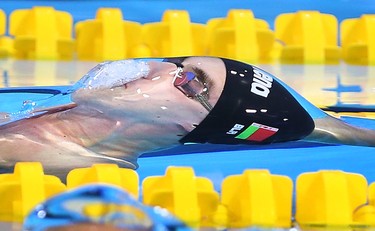 Pavel Sankovich, from Belarus breaks the surface during the 50M backstroke final during the 2016 FINA World Swimming Championships (25M) at the WFCU Centre in on Dec. 9, 2016.