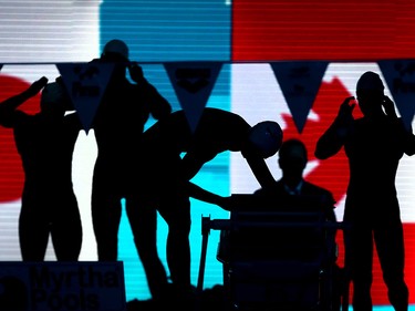 Swimmers prepare for the start of the Womens 50M Medley final during the FINA World Swimming Championships held at the WFCU Centre.