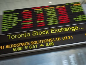Financial numbers flow on the digital ticker tape at the TMX Group in Toronto's financial district in this file photo.