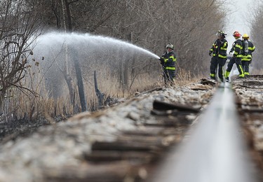 Firefighters battle a fire behind J&B Auto Parts on Provincial Road in Windsor on Thursday, March 9, 2017.