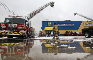Firefighters battle a fire behind J&B Auto Parts on Provincial Road in Windsor on Thursday, March 9, 2017.
