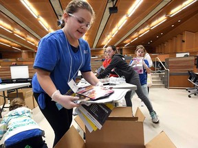 Members of Windsor-Essex Girl Guide troops sort materials for recycling as part of an activity during Badge Day at the University of Windsor's engineering building on March 11, 2017.