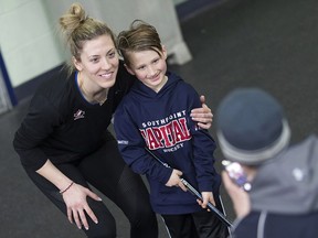 Ruthven native Meghan Agosta poses for a photo with Matthew Mastromatteo, 7, after a practice with the Canadian women's national hockey team at the Leamington Kinsmen Recreation Complex on March 25, 2017.