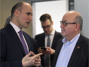 Jean-Yves Duclos, federal minister of families, children and social development, left, speaks with Tecumseh Mayor Gary McNamara on March 23, 2017 in Windsor, Ont.